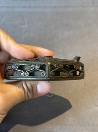 A Chinese reticulated lozenge-shaped double-walled bronze water dropper, 16th C.