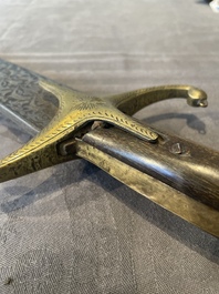 A silver plated dagger and four swords, China, Burma and Indonesia, 18/19th C.