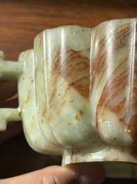 A Chinese celadon and russet jade wedding cup, 18th C.