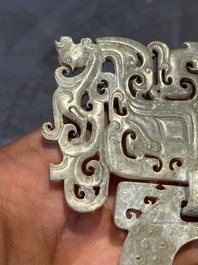 A Chinese nephrite jade 'bi' disc representing a Taotie mask, Han