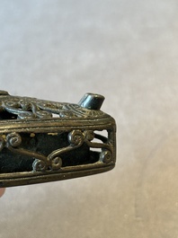 A Chinese reticulated lozenge-shaped double-walled bronze water dropper, 16th C.