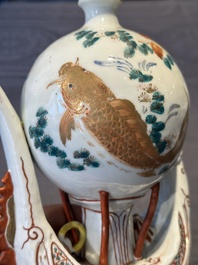 Two Chinese famille rose vases, two teapots and a Japanese wucai ewer, 19th C.