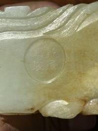 A Chinese white jade 'dragon' ink container with Qianlong mark and possibly of the period