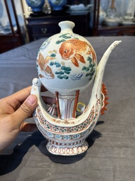 Two Chinese famille rose vases, two teapots and a Japanese wucai ewer, 19th C.