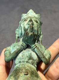 An fine Indonesian bronze sculpture of a naked man offering a sacrificial vase, Majapahit, East Java, 13/14th C.
