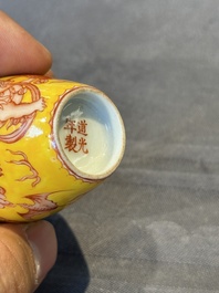 A Chinese jade snuff bottle and a yellow-ground iron-red snuff bottle, Daoguang mark, 19th C.