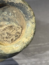 A Chinese archaic bronze ritual wine vessel with buffalo heads, 'zhi 觯', Western Zhou