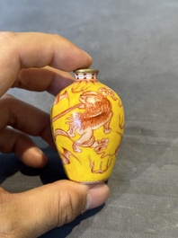 A Chinese jade snuff bottle and a yellow-ground iron-red snuff bottle, Daoguang mark, 19th C.