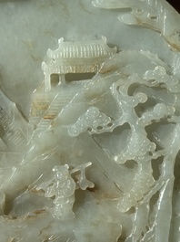 A Chinese celadon and russet jade plaque with landscape design, 19th C.