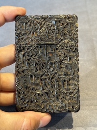 A Chinese jade carving, a tortoiseshell card holder and an iron-red snuff bottle, 19th C.