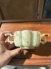 A Chinese celadon and russet jade wedding cup, 18th C.