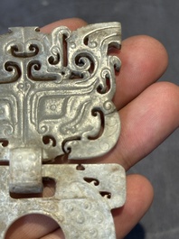 A Chinese nephrite jade 'bi' disc representing a Taotie mask, Han