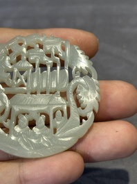 Two Chinese round jade plaques on carved wooden stands, 19th C.