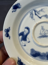 A Chinese blue and white 'Long Eliza and playing boy' cup and saucer, Qi Yu Mei Zhi 奇玉美製 and Bi Yu Tang Zhi 璧玉堂製, Kangxi
