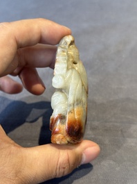 A Chinese jade carving, a tortoiseshell card holder and an iron-red snuff bottle, 19th C.