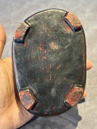 A Chinese scholar's rock on wooden stand, Ming or later