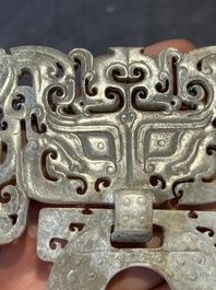 A Chinese nephrite jade 'bi' disc representing a Taotie mask, Han