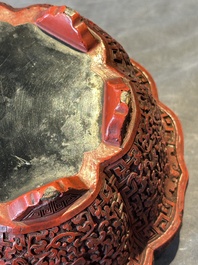 A Chinese red cinnabar lacquer jardiniere with floral design, Yongzheng/Qianlong