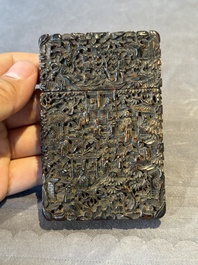 A Chinese jade carving, a tortoiseshell card holder and an iron-red snuff bottle, 19th C.