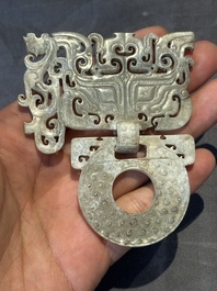 A Chinese nephrite jade 'bi' disc representing a Taotie mask, Han