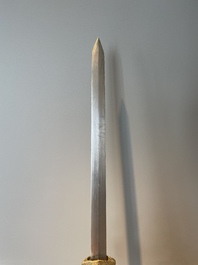 A silver plated dagger and four swords, China, Burma and Indonesia, 18/19th C.