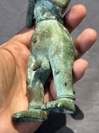An fine Indonesian bronze sculpture of a naked man offering a sacrificial vase, Majapahit, East Java, 13/14th C.