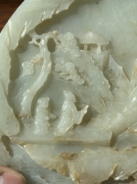 A Chinese celadon and russet jade plaque with landscape design, 19th C.