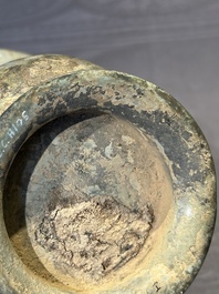A Chinese archaic bronze ritual wine vessel with buffalo heads, 'zhi 觯', Western Zhou