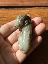 A Chinese partly black coloured white jade dog carving, Qing