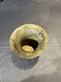 A Chinese archaic bronze ritual wine vessel with buffalo heads, 'zhi 觯', Western Zhou