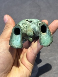 An fine Indonesian bronze sculpture of a naked man offering a sacrificial vase, Majapahit, East Java, 13/14th C.