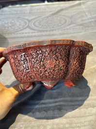 A Chinese red cinnabar lacquer jardiniere with floral design, Yongzheng/Qianlong