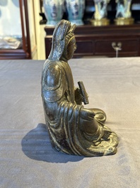 A rare Chinese parcel-gilt and lacquered pewter Guanyin, 17/18th C.