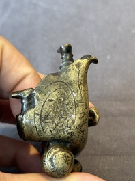 A Chinese bronze paperweight in the form of 'Shi De 拾得' on wooden stand, 16th C.