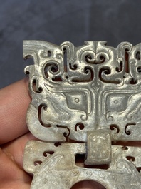 A Chinese nephrite jade 'bi' disc representing a Taotie mask, Han
