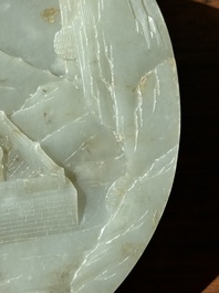 A Chinese celadon and russet jade plaque with landscape design, 19th C.