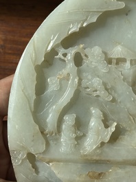 A Chinese celadon and russet jade plaque with landscape design, 19th C.
