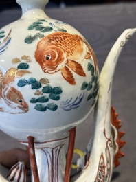 Two Chinese famille rose vases, two teapots and a Japanese wucai ewer, 19th C.