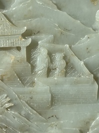 A Chinese celadon and russet jade plaque with landscape design, 19th C.