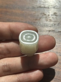 A Chinese white jade carving of a chilong reclining on bamboo, Qing