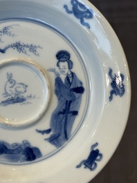 A Chinese blue and white 'Long Eliza and playing boy' cup and saucer, Qi Yu Mei Zhi 奇玉美製 and Bi Yu Tang Zhi 璧玉堂製, Kangxi