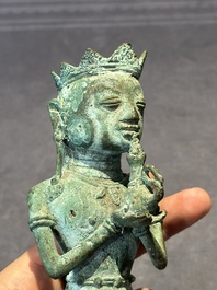 An fine Indonesian bronze sculpture of a naked man offering a sacrificial vase, Majapahit, East Java, 13/14th C.