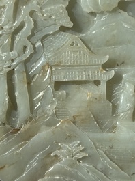 A Chinese celadon and russet jade plaque with landscape design, 19th C.