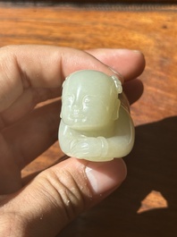 A Chinese white jade carving of a reclining boy, Qing