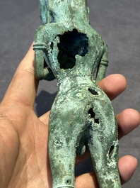 An fine Indonesian bronze sculpture of a naked man offering a sacrificial vase, Majapahit, East Java, 13/14th C.