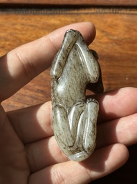 A Chinese partly black coloured white jade dog carving, Qing