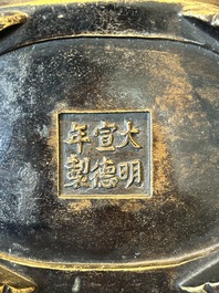 A rare Chinese bronze narcissus basin-shaped censer with dragon handles, Xuande mark, 17th C.