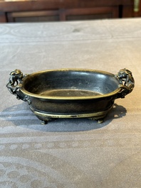 A rare Chinese bronze narcissus basin-shaped censer with dragon handles, Xuande mark, 17th C.