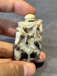 A Chinese jade snuff bottle and a yellow-ground iron-red snuff bottle, Daoguang mark, 19th C.
