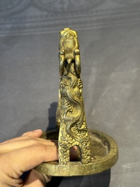 A pair of Chinese imperial gilt-bronze stirrups with dragons, De 德 mark, 18th C.